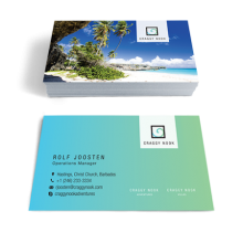 Two stacks of business cards. Front of card has a palm tree and beach with logo. The back has contact details on an aqua marine gradient background